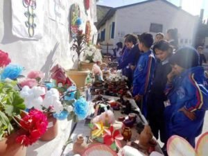 Students observing clay and paper work